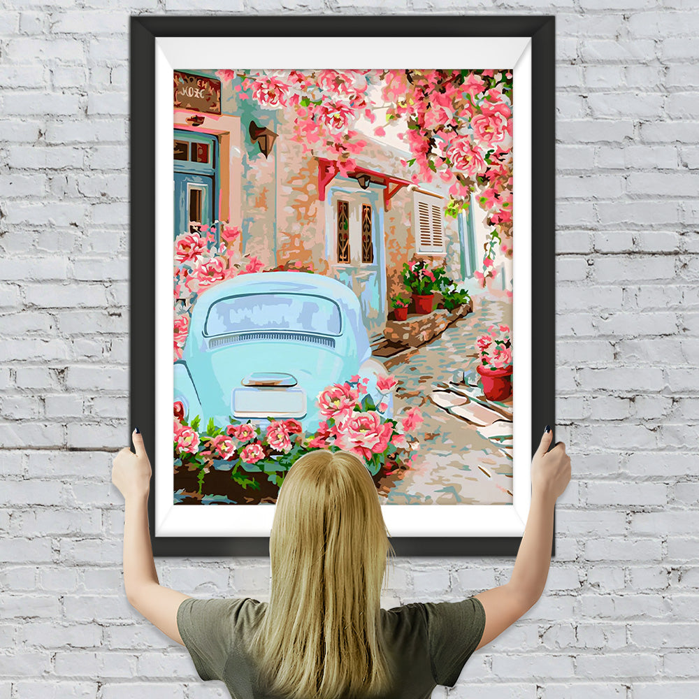 Blaues Auto unter rosa Blumenbaum Diamond Painting