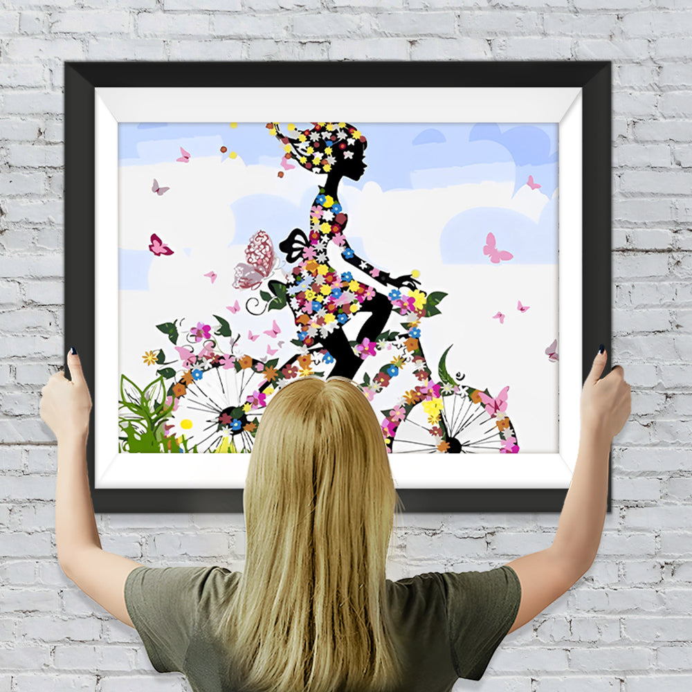Das Mädchen fährt ein Blumenfahrrad Diamond Painting