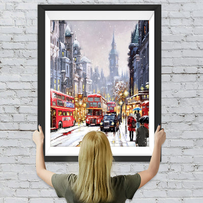 Geschäftige Stadt bei starkem Schneefall Diamond Painting
