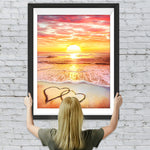 Herzförmiger Sandstrand und rosa Wolken Diamond Painting