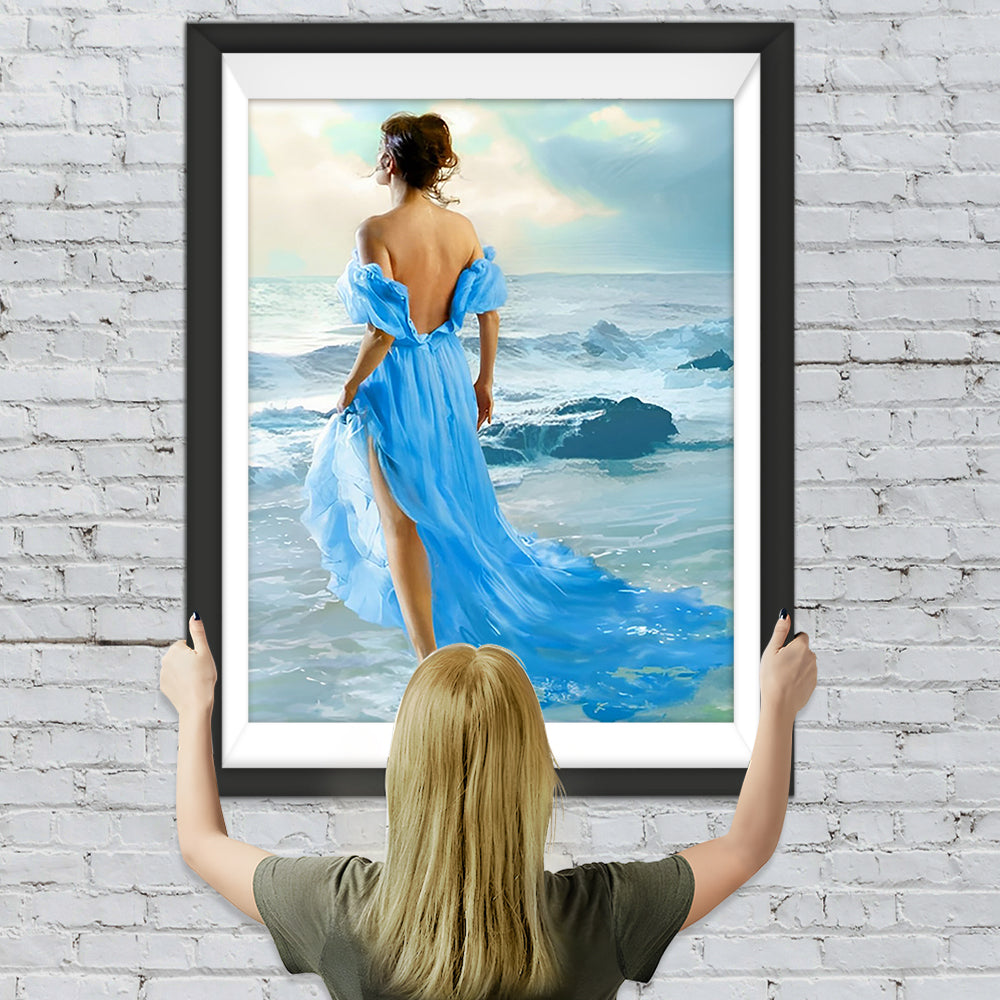 Schöne Frau im blauen Kleid am Meer Diamond Painting