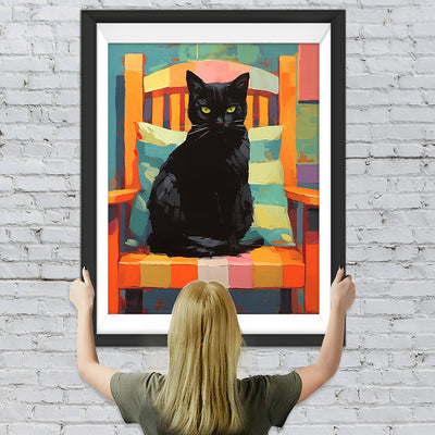 Schwarze Katze auf einem bunten Stuhl Diamond Painting