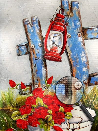 Blauer Zaun, rote Kerosinlampe und rote Blumen Diamond Painting